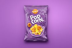 a bag of pop corn on a purple background