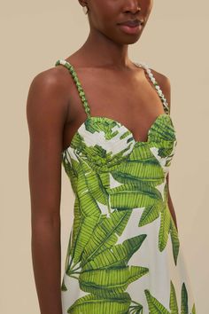 Breathe in the tropical allure of the Palm Fan Off-White Midi Dress, adorned with a refreshing green palm leaf print. This enchanting piece features a flattering sweetheart neckline and playful braided straps, creating a harmonious symphony of natural elegance and graceful femininity. The tiered skirt dances around the mid-calf, promising to whisk you away on an endless summer adventure with every swish. Indulge in the beauty of nature elegantly draped in this exquisite FARM Rio creation. Compos Palm Springs Fashion, Palm Fan, True Spring, Tropical Dress, White Midi, Dress Home, Summer Solstice, Farm Rio, White Midi Dress