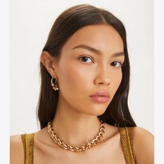 Delicate geometry. Graphic cutouts reinterpret the classic good luck charm on our Kira Clover Hoop Earring. For pierced ears. Tarnish Resistant Hoop Necklace, Tory Burch Kira, Luck Charm, Luck Charms, Pierced Ears, Designer Jewelry, Designer Earrings, Ear Piercings, Good Luck