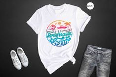 Get ready for the most adorable and exciting family trip of 2024! Introducing our cute destination-inspired T-shirt, perfect for your family gathering and adventure-filled road trip. With its vibrant design and summer vibes, this shirt captures the essence of a fun summer vacation. Made with love and crafted to perfection, this traveler gift is a must-have for any family setting off on a memorable vacation. The design features a mesmerizing mix of colors, showcasing the spirit of your upcoming f Quality Family Time, Family Vacation Shirts, Adventure Shirt, Family Tees, Family Set, Family Trip, Cute Family, And So The Adventure Begins, Travel Shirts