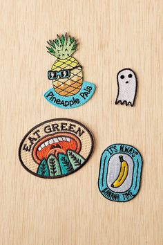 three patches that say eat green, eat pineapple, and have ghost on them