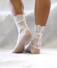 - Handmade with beautiful ornamental lace and matching mesh fabric - Soft, comfortable and look so pretty on! - Sewn with uniquely created pattern to fit your feet best - Available in 3 sizes: Small, Medium, Large SMALL fits: US: 6 - 7.5, EU: 35.5 - 37.5, UK: 4 - 5.5 MEDIUM fits: US: 8 - 9.5, EU: 38 - 40.5, UK: 5.5 - 7 LARGE fits US: 10 - 12.5, EU: 42 - 45, UK: 8 -10.5 Fiber Content: - 90% Nylon, 10% Spandex Care Instructions: - Hand wash or Machine gentle cycle wash cold - Air Dry Fitted Lace Trim Socks For Summer, Summer Lace Trim Fitted Socks, Fitted White Socks With Lace Trim, White Stretch Party Socks, Elegant Fitted Lace Socks, White Stretch Lace Hosiery, White Lace Hosiery, Sheer Lace Hosiery For Parties, White Stretch Hosiery With Lace Trim