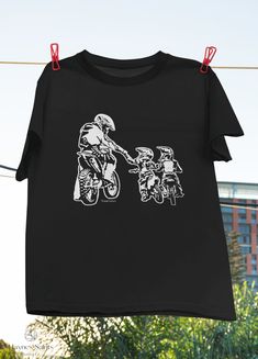 "Product: Cool Dad Dirt Bike Gift Rider Motocross Father Son Biker Riding Gift T-Shirt, Dirt Bike Dad Shirt, Father's Day Shirt, Passion Shirt 💫 Welcome to our store! ✔️ PRODUCTS DETAIL: ▸ Available ALL types of clothing you NEED (8 types from kid to adult, hoodies, sweatshirts, tanktop,..) ▸ Light & Soft cotton fabric (Some colours contain polyester). ▸ High-quality Direct To Garment printing, guaranteed not to wash off or fade. ▸ Fit T-shirts, perfect gift idea for your family, friends... ✔️ SIZING: See size guide in gallery for exact measurements. If you want more of a tight ladies fit, we suggest going down one size. If not, take your normal size. ✔️ CUSTOM AND PERSONALIZED ORDERS: ▸ You can request a custom change on any of our products. ▸ You can give us your idea, and we will make Dirt Bike Shirts, Moto Mom, Bike Gift, Bike Shirts, Father Son, Fathers Day Shirts, Dirt Bike, Father And Son, Dad To Be Shirts