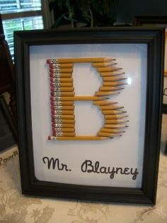 a framed picture with pencils in it and the words mr blayney written on them