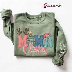 Link to add on a message card, gift card: https://www.etsy.com/listing/1462461713/godmerch-custom-gift-message-card Mimi Christmas Sweatshirt, Custom Mimi Est And Kids, Grandma Gift TH Sweatshirt If you looking for a personalized t-shirt to show your love to your family, it's will be best choice. Our Classic T-Shirt serves as the perfect short-sleeved shirt for your unique, funny, or personalized designs. Features such as a lay flat collar and a classic unisex cut will make this your new favorit Christmas Gift Cotton Sweater, Customizable Winter Gift Sweatshirt, Green Winter Sweatshirt For Gift, Green Winter Sweatshirt For Gifts, Green Winter Sweatshirt Gift, Green Winter Sweatshirt As Gift, Christmas Sweater With Letter Print As Gift, Mimi Gift, Mama Sweater