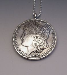 Silver Lady Dollar Pendant made from US Morgan Dollar Coin Handmade Sterling Silver Coin Necklace, Handmade Silver Coin Necklace, Handmade Silver Round Coin Necklace, Vintage Silver Coin Necklace For Jewelry Making, Handmade Vintage Round Coin Necklace, Collectible Sterling Silver Coin Necklace With Round Pendant, Vintage Silver Coin Jewelry, Sterling Silver Coin Necklace With Round Pendant For Collectors, Classic Stamped Coin Jewelry