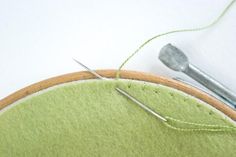 a close up of a piece of cloth with needles