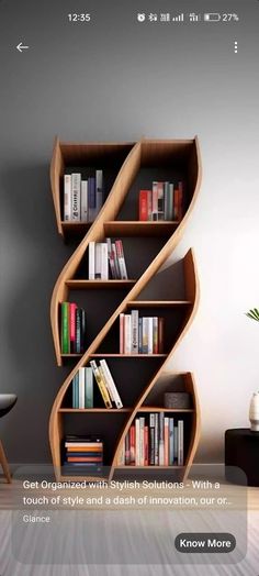 a book shelf with books on it next to a chair