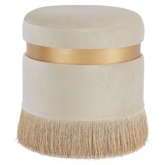 a white brush with gold trim on it