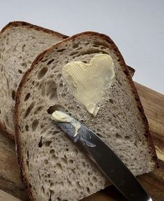 a piece of bread with butter on it and a knife