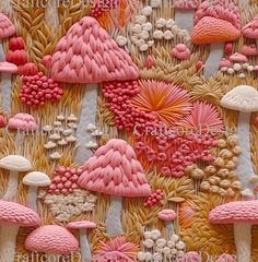 some very pretty pink and white decorations on a tablecloth with mushrooms in the background