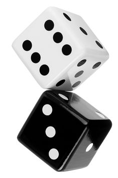 two black and white dices are stacked on top of each other, with one falling to the side