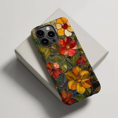 an iphone case with flowers painted on it