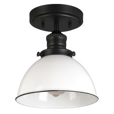 an overhead light fixture with a white glass dome on the top and black metal trim