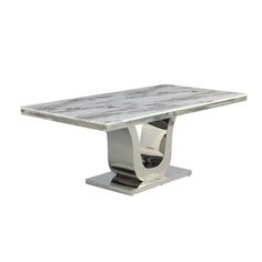 a white marble dining table with silver metal legs and an abstract design on the top