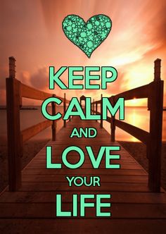 a wooden dock with the words keep calm and love your life written in green on it