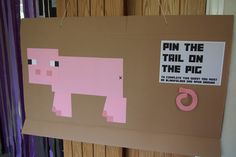 a bulletin board with pink and brown paper cut out of it's shape, depicting a pig