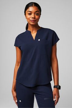 Evolve Scrub Top Fabletics Navy female Activewear >> Scrubs >> Tops >> Product Feed MotionTech regular 4-Way Stretch/Breathable/Hidden Pockets/Lightweight Scrub Top With Jeans, Navy Scrubs Outfit, Fabletics Scrubs, Traveling Nurse, Navy Scrubs, Female Activewear, Nurse Scrubs, Scrub Style, Headshots Women