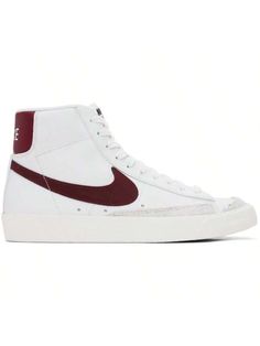 Nike 
White & Red Blazer Mid '77 Vintage Sneakers 
High-top buffed leather sneakers in white and red. 
. Suede trim in gray throughout 
. Lace-up closure 
. Textile logo patch at padded tongue 
. Padded collar 
. Swoosh and perforated detailing at sides 
. Logo printed at heel tab 
. Textured rubber midsole 
. Treaded rubber outsole 
Please note that this item may be shipped only within North America. 
Supplier color: White/Team red 
Upper: leather. Sole: rubber. 
Made in Indonesia. 
241011M2360 White High-top Sneakers With Logo Patch, High-top Skate Shoes With Logo Patch, Retro Mid-top Sneakers With Red Sole, Mid-top White Skate Shoes With Red Sole, Blazer Mid 77 Vintage, Casual Athletic Shoes, Team Red, Vintage Sneakers, Textile Logo