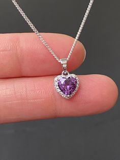 "Sterling Silver Amethyst CZ Heart Necklace Amethyst is the birthstone for February, this makes a great gift for those loved ones born February. Metal: All components are made from solid .925 Sterling Silver Stone: Cubic Zirconia Center Stone size: 7mm Center Stone Carat Weight: 1.6ct Measurement: pendant height is 14mm (0.55\") including bail and 10mm (0.39\") wide Choose Chain Length At Checkout Please feel free to Convo me with any questions before purchasing. Please view policy before purcha Army Accessories, February Birthstone Jewelry, Neck Pieces Jewelry, Amethyst Heart, Sterling Silver Heart Necklace, Necklace Amethyst, Necklace Art, Pandora Bracelet Charms, Gift For Daughter