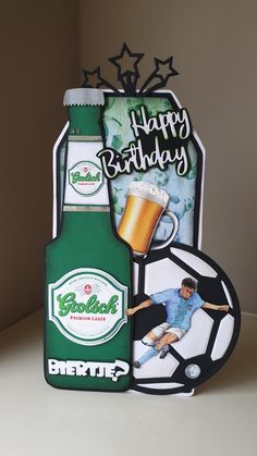 a birthday card with an image of a man holding a soccer ball and a beer