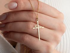 Custom Cross Sign Name Necklace                                  🍀 Material: High Quality 925 Sterling Silver 🍀 Finish: Gold, Silver, Rose Gold 🍀 Chain Size  - Standard 16 inch chain + 2 inch extension chain.  H O W ∙ T O ∙ O R D E R 🍀 Select your Necklace Finish  in the drop down menu.  🍀 Select your font style for name  .  T U R N  A R O U N D   T I M E  🍀 All items are custom made to order. Our turn around time is about  9-12 Days.  This can change during peak seasons. Delivery days is about 3-5business days. PACKAGING and SHIPPING 🍀 All your loved gifts are package nicely in a wonderful gift box. Your order will be placed in 1 gift box with the gift option you choose in your order. If you want a different box for each, you will need to purchase an extra box as it will affect the Cross-shaped Name Jewelry For Anniversary, Name-engraved Cross Jewelry For Anniversary, Anniversary Jewelry With Name And Cross Shape, Personalized Crucifix Necklace For Anniversary, Personalized Cross Pendant Necklaces For Birthdays, Cross Pendant Jewelry With Name For Gift, Name Engraved Cross Pendant Jewelry For Gift, Name-engraved Cross Pendant Jewelry Gift, Name Engraved Cross Pendant Jewelry Gift