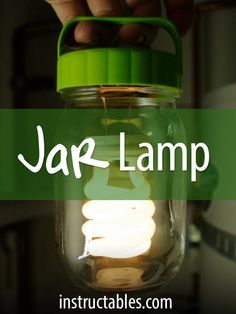 a person holding a mason jar with the words jar lamp above it and underneath it