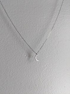 This is a delicate silver crescent moon pendant on a fine stainless steel chain. It comes in multiple lengths. It will never tarnish and is constructed from extremely high quality materials! Choose your preferred length at no extra cost! Thanks so much! Silver Moon Charm Necklace With Adjustable Chain, Nickel Free Half Moon Silver Necklace, Silver Crescent Necklace With Adjustable Chain, Silver Crescent Moon Phase Charm Necklace, Nickel-free Silver Half Moon Necklace, Nickel-free Silver Half-moon Necklace, Silver Half Moon Charm Necklaces, Silver Dainty Moon Charm Necklace, Silver Half Moon Charm Necklace