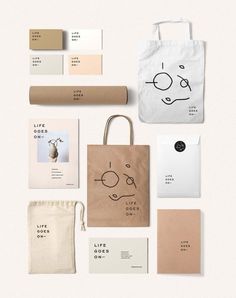 the branding and packaging design for an artisan brand is shown in white, beige, and black