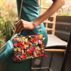 Imagine the joy of breaking open a pinata - that's the feeling we've bagged in this Simitri masterpiece. A briefcase clutch that celebrates you, the fearless gal who commands attention with every entrance, whether it’s in the boardroom, the bar or the ballroom. This fiesta in a clutch is crafted with sequins in unusual shapes, neon and metallic hues and this clutch is your personal fireworks display. As you carry it, watch heads turn, compliments flow, and joy follow your every step. The hidden Briefcase Bag, Fireworks Display, Velvet Interiors, The Bar, Ballroom, Metal Chain, Wearable Art, Fireworks, Entrance