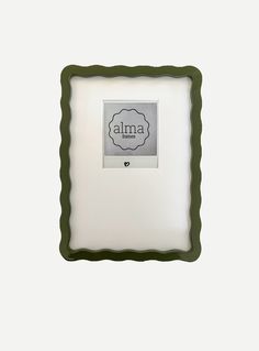 a square frame with the word alma on it and a heart in the middle, against a white background