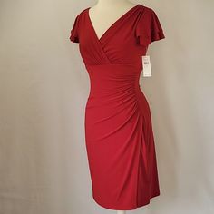 Surplice V-Neck Dress From Lauren Ralph Lauren Is New With Tags! Go From Career To Cocktails In This Easy Versatile Dress! Cool Crimson Red Surplice V-Neckline, With Tiered Ruffle Sleeves & Ruching At Left Side Flattering Feminine Silhouette!! Polyester/Elastane For Easy Stretch That Drapes Beautifully! Size 4 (See Photo Of Measurements) No Flaws Or Damage 2550 Office, Date Night, Cocktail, Special Occasion, V-Neckline, Surplice, Ruching, Ruffle Sleeves, Feminine, Flattering **Buy With Confidenc Red Fitted V-neck Dress With Short Sleeves, Red Fitted V-neck Dress With Surplice Neckline, Fitted Knee-length Ruched V-neck Dress, Ruched Waist Dress, Easy Stretches, Crimson Red, Versatile Dress, Feminine Silhouette, Star Top