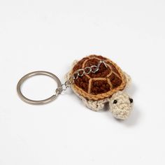 a crocheted keychain with a turtle on it