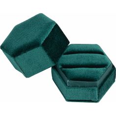 a green velvet jewelry box with the lid open