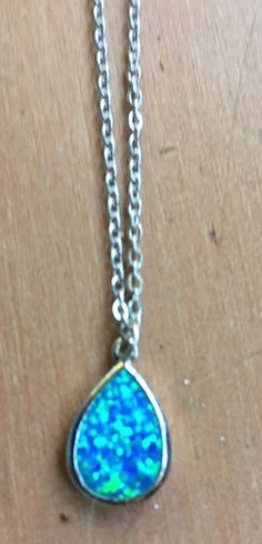 "Magical, glittery powder blue teardrop stone pendant, says China FD 925 on the back so it's manufactured by \"FD\" and it's made of 925 silver. It's hard to capture the texture of the pendant in my photos, but it's a sparkly blue with green iridescent highlights, and very smooth to the touch. The chain measures about 20\" and the pendant is about .625 by .5\". Please take a look at my storefront at: https://www.etsy.com/shop/FabFinds42?ref=seller-platform-mcnav I have a wide selection of one-of Blue Sterling Silver Drop Necklace For Gift, Blue Sterling Silver Drop Necklace As A Gift, Handmade Blue Pear-shaped Jewelry, Blue Teardrop Pendant Necklace In Sterling Silver, Blue Sterling Silver Teardrop Pendant Necklace, Blue Teardrop Spiritual Jewelry, Adjustable Blue Teardrop Drop Necklace, Adjustable Teardrop Blue Drop Necklace, Handmade Blue Teardrop Drop Necklace