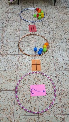 two children's toys are on the floor with circles