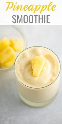 pineapple smoothie in a small glass bowl with a bite taken out of it