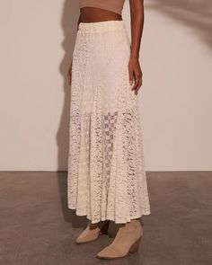 Embrace your free-spirited style with the Sundrenched Lace Maxi Skirt, a dreamy piece that captures the essence of New Boheme. This skirt features a lightweight lace fabric overlay that flows effortlessly with every step, creating a romantic silhouette perfect for sun-soaked days. The elastic waistband offers comfort a Chic Lace Maxi Skirt With Lace Trim, Lace Patchwork Maxi Skirt, White Scalloped Lace Skirt, Chic Cream Skirt With Lace Trim, Chic Delicate Lace For Summer, Lace Tiered Skirt Bottoms With Lace Patchwork, Chic Lace Lined Maxi Skirt, Lace Skirt With Lace Work, Elegant Summer Skirt With Lace Patchwork