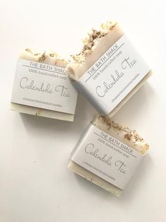 three bars of soap sitting next to each other on a white counter top with the label labeled, caledale tea