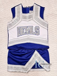 Cheer Uniform, Custom Cheer Uniform, Uniform Toddler Cheer Uniform, Girls Cheer Outfit, Toddler Cheer Top/Skirt Great for game days, pep rallies or just to show some team spirit. Uniforms can be customized with your team name and team colors. Processing Time My processing time is 1-2 weeks. This is the time it takes for your order to be created and ready for shipment. Shipping/Transit time is not included with processing time. If you need your items sooner than my standard processing time please message me and I will try to accommodate if I can. Rush Processing will include an additional fee. If you place a Rush Order without messaging me first, your order could be canceled if I don't have the time to complete it in the time frame that you need. Please message me first to avoid any issues Fitted White Tops For Cheerleading, White Fitted Tops For Cheerleading, Fitted Blue School Sets, White Cotton School Spirit Sets, Blue Fitted School Sets, White Cotton Cheerleading Sets, Blue And Red Cheer Uniforms, Fitted Cotton Cheerleading Sets, Cheerleading Outfits Blue