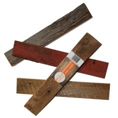 four different colored wood planks are stacked on top of each other in the shape of a cross