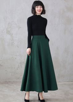 "This winter wool skirt is a classic piece of tailoring that will see you through rain or shine. It is cut with a flattering flared skirt to give you a wonderful shape. The winter skirt is perfect classic styling and ends at the ankle. This is a versatile skirt that you'll wear again and again. DETAILS: * More colors available https://etsy.me/3kURa6k * 30% wool, 30% fiber, 40% polyester * fully satiny liner * Two side pockets * Right zip closure * A little Back elastic, comfortable wear * Plus s Winter Full Length Solid Skirt, Winter Full-length Solid Skirt, Fitted A-line Skirt For Winter, Winter Full-length Pleated Skirt, Fitted Full Maxi Skirt For Winter, Green Fitted A-line Maxi Skirt, Winter Flared Green Skirt, Winter Green Flared Skirt, Winter Long Green Skirt