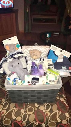 a basket filled with baby items sitting on top of a table