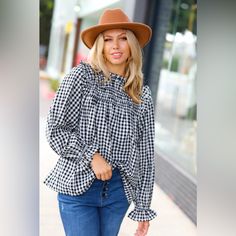 Refresh Your Casual Closet While Adding A Touch Of Femininity With This Shirred Yoke Top With Long Elastic Ruffle Sleeves. A Stunning Frill Mock Neck And Keyhole Button Back Completes This Versatile And Stunning Top. Shirred Yoke + Mock Neck + Gingham Print Woven 100% Polyester Designed In Los Angeles Made In China Runs True To Size Weight: .5 Lbs; Plus .6 Lbs. Bust (Side Seam To Side Seam): S 19" M 19.5" L 20" 1x 22" 2x 22.5" 3x 23" Length (Shoulder To Hem): S 25.5" M 26" L 26.5" 1x 28" 2x 28.5 Trendy Plaid Blouse For Fall, Casual Gingham Blouse For Fall, Trendy Gingham Blouse For Fall, Plaid Blouse For Day Out In Fall, Plaid Blouse For Fall Day Out, Classic Plaid Blouse For Fall, Spring Houndstooth Pattern Blouse, Chic Gingham Long Sleeve Tops, Chic Gingham Blouse For Fall