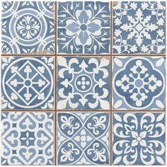 blue and white tiles with different designs on them