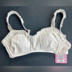 Questions? Leave A Comment Below! White Lined Tankini For Vacation, White Ruffled Tankini For Beachwear, White Tops With Removable Bra Pads For Summer, White Summer Tops With Removable Bra Pads, White Underwire Top For Summer, White Lined Beach Top, White Sleeveless Ruffled Tankini, White Ruffled Tankini, White Underwire Summer Top