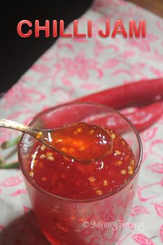 chili jam in a small glass bowl with a spoon