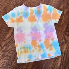 Hanes T-Shirt, Size Xs. My Daughter Tied Dyed This So It Was A White T-Shirt Then She Made It Colorful! Unfortunately She Outgrew It And It Looks Brand New And So Fun! Casual Multicolor Washed Tops, Casual Rainbow Hand Dyed Tops, Hand Dyed Rainbow Top For Summer, Rainbow Colored Hand Dyed Short Sleeve Tops, Casual Hand Dyed Rainbow Top, Rainbow Hand Dyed Short Sleeve Tops, Casual Tie Dye Top With Watercolor Print, Casual Tie Dye Watercolor Print Top, Multicolor Bleached Crew Neck Top