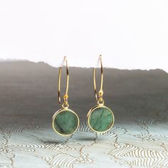 "Raw Emerald Gold Drop Earrings - Minimalist Geometric Green Emerald Circle Drop Earrings - Gold Jewelry gifts for her, mom, wife, daughter NECKLACE SOLD SEPARATELY Stone: Genuine Raw Emerald Please note due to nature of our genuine stones no two are alike and the ones you will receive will vary slightly from the ones pictured in the photos. Bezel: Vermeil Gold Ear-wire: 14k Gold Filled Total length of earring: 35mm Circle Gemstone: 12mm diameter About \"Gold Filled Jewelry\": Also called rolled Minimalist Single Green Earring, Modern Round Earrings For Gifts, Dainty Round Threader Earrings Gift, Dainty Round Threader Earrings For Gifts, Minimalist Yellow Gold May Birthstone Earrings, Everyday Green Lever Back Earrings, Green Minimalist Drop Earrings, Dainty Linear Earrings As Gift, Minimalist Yellow Gold Earrings For May Birthstone