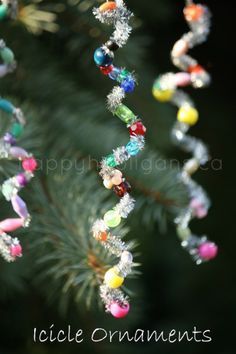 a pine tree with beads hanging from it's branches and the words icicle ornaments